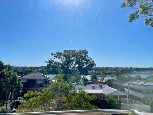 a view of a city with houses and trees at Salt & Serenity - The Peninsula Retreat in Cronulla