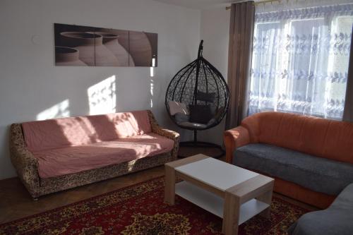 a living room with a couch and a table at DáMa in Ružomberok