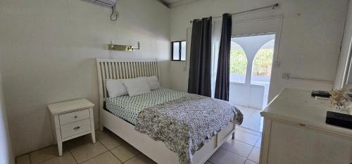 Ένα ή περισσότερα κρεβάτια σε δωμάτιο στο Wavecrest Suites