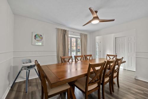 a dining room with a wooden table and chairs at Dublin Blue Haven - Home for 12 in Dublin