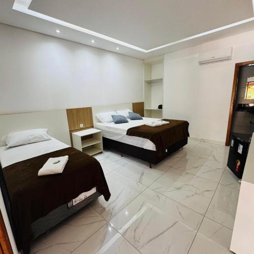 Ένα ή περισσότερα κρεβάτια σε δωμάτιο στο Pousada Circuito