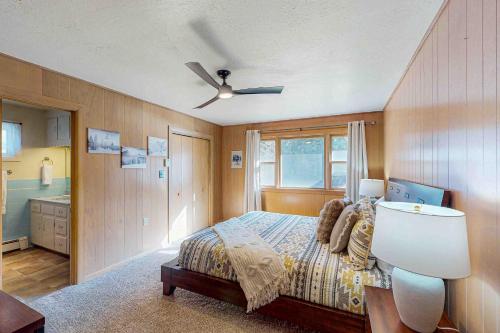 a bedroom with a bed and a ceiling fan at Rainbow Riverhouse in South Fork