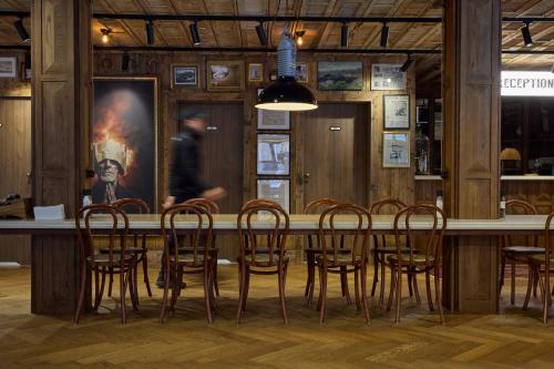 a restaurant with a table and chairs in a room at Hotel Akureyri in Akureyri
