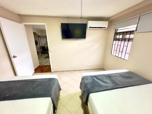 TV a/nebo společenská místnost v ubytování Hotel Estadio 80