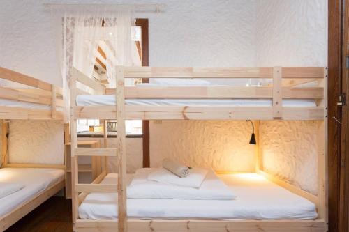Postel nebo postele na pokoji v ubytování Sansofi Guesthouse