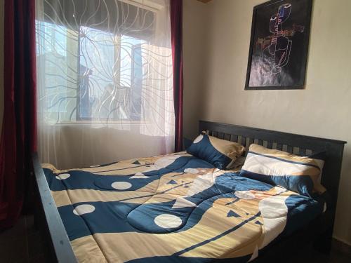 Ένα ή περισσότερα κρεβάτια σε δωμάτιο στο Nzuri Homes