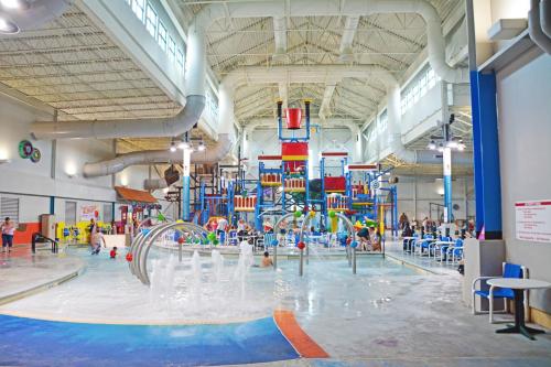 a large indoor swimming pool with a water park at Grand Harbor Resort and Waterpark in Dubuque