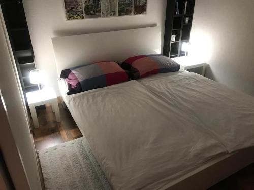 Ένα ή περισσότερα κρεβάτια σε δωμάτιο στο Traumstrand Vitznau