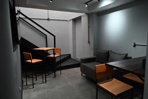 a living room with a couch and a table and chairs at O Ogro in Brasilia