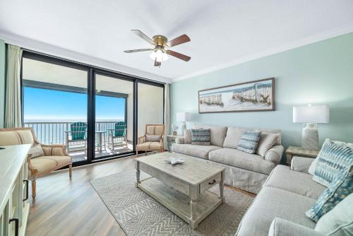 a living room with a couch and a table at Summer House Unit 602A in Orange Beach
