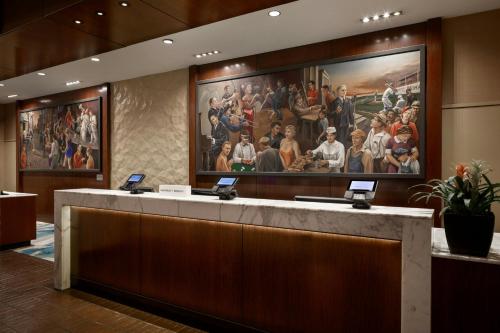 a lobby with a large painting on the wall at Kansas City Marriott Downtown in Kansas City