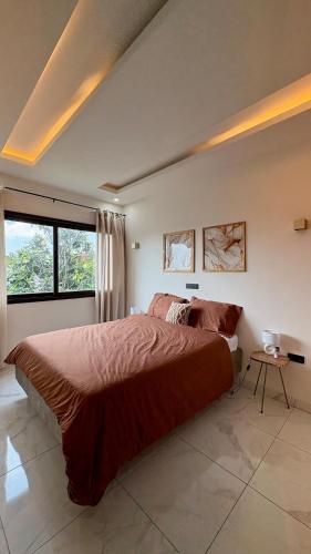 Ένα ή περισσότερα κρεβάτια σε δωμάτιο στο Résidence Yvette cocody Rivièra N'badon