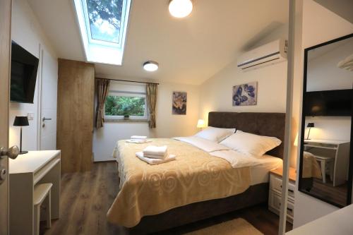 Ένα ή περισσότερα κρεβάτια σε δωμάτιο στο AdisiTi S2