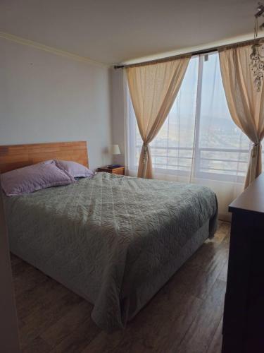 Giường trong phòng chung tại Departamento Tamarugal