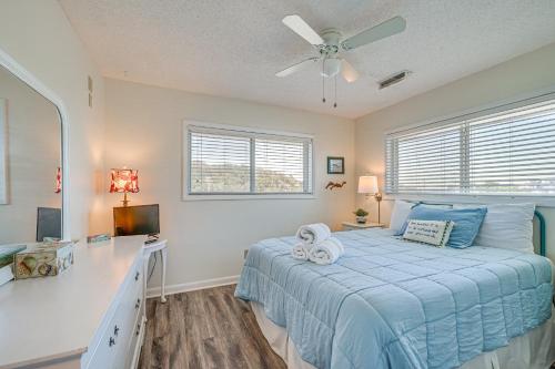 Giường trong phòng chung tại Walk to Kure Beach! Bright Condo with Ocean Views