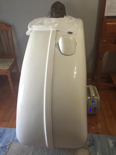 a white refrigerator with a bed on top of it at Lajava Guest Lodge in Krugersdorp