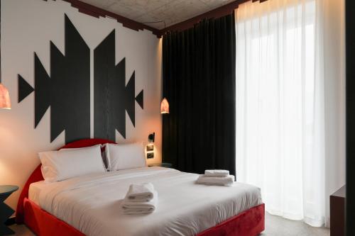 Кровать или кровати в номере Bazaar Hotel