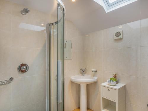 a bathroom with a shower and a sink and a toilet at Bay - Uk44720 in Ravenscar