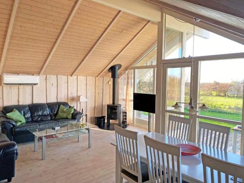 a living room with a couch and a table at 5 star holiday home in Vestervig in Vestervig