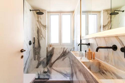 Acropolis 1910s Neoclassical Gem Marble Bathrooms
