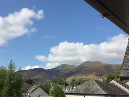a view of mountains from a town with houses at Hindscarth in Keswick