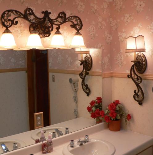 a bathroom with a sink and a mirror at Mistral in Minami Uonuma