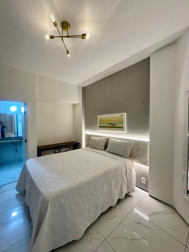a bedroom with a bed and a ceiling fan at 957 golden fortaleza frente mar in Fortaleza