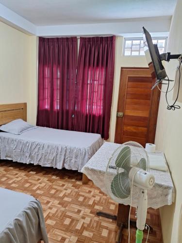 Voodi või voodid majutusasutuse Hospedaje Marvento toas