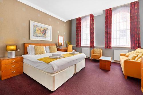 Ένα ή περισσότερα κρεβάτια σε δωμάτιο στο Pilcher Gate House