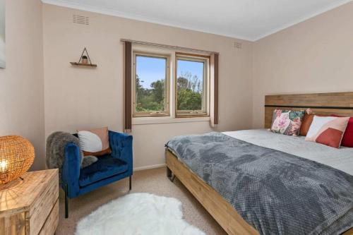 En eller flere senge i et værelse på The Great Ocean Villa