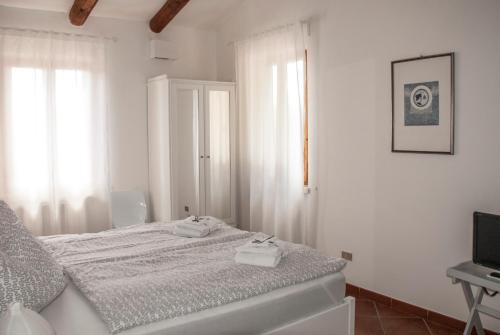 Ένα ή περισσότερα κρεβάτια σε δωμάτιο στο Calmancino delle Selve