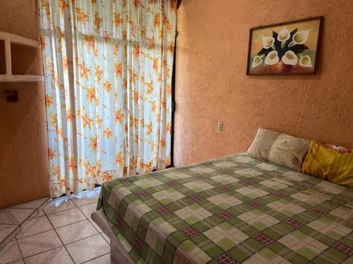 En eller flere senge i et værelse på Hotel Diana cazadora