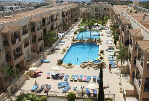 an aerial view of a pool in a resort at Front pool garden apartment in Paphos