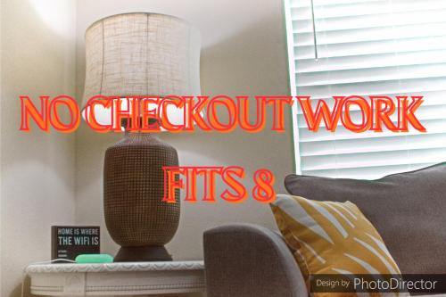 a sign that reads no checkout work in a living room at No Checkout Work! NEW Family Friendly Stay! in College Station