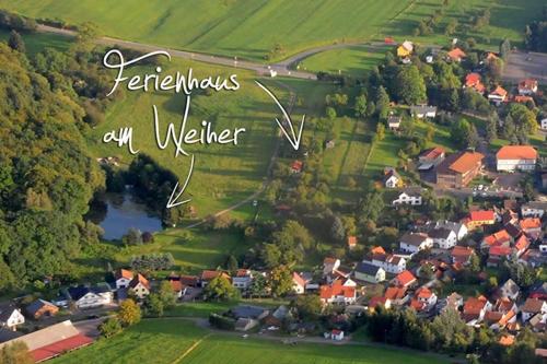 a village in the countryside with the words facilitate any welder at Ferienhaus Am Weiher in Waltershausen