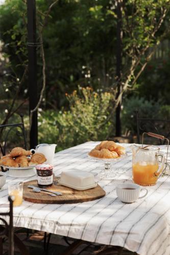 a picnic table with bread and other food on it at The Old Clarence Brewery in Maclean