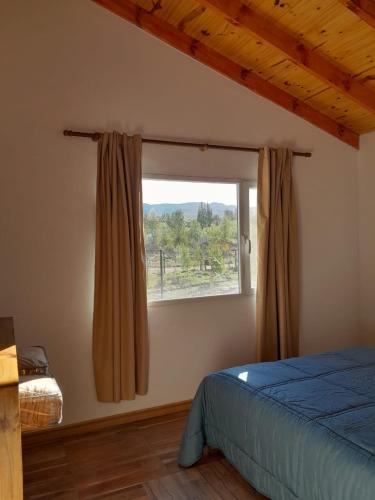 Ένα ή περισσότερα κρεβάτια σε δωμάτιο στο Cabañas Los Teros