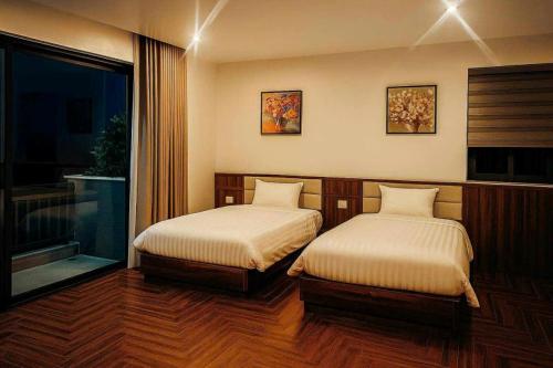 Ένα ή περισσότερα κρεβάτια σε δωμάτιο στο Luxury 88 Hotel