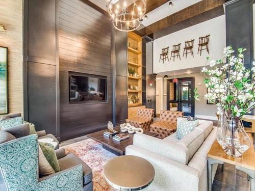 a living room with a couch and chairs and a table at Contemporary Comfort Near The Woodlands in Spring