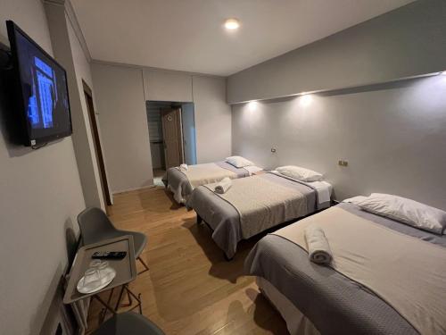 En eller flere senge i et værelse på Aloja Hotel - Frente al Mall Portal Osorno