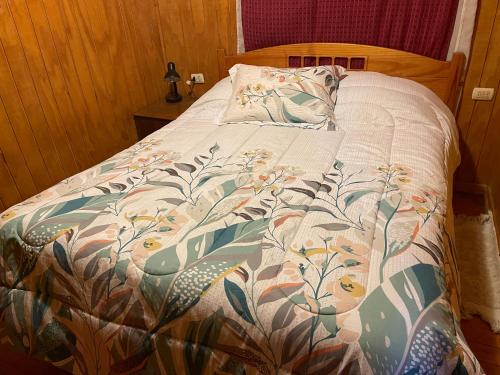 Un pat sau paturi într-o cameră la Cabaña Entrevientos