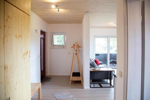 a living room with a ladder in the middle of a room at Ferienwohnung Im Illertal in Altenstadt