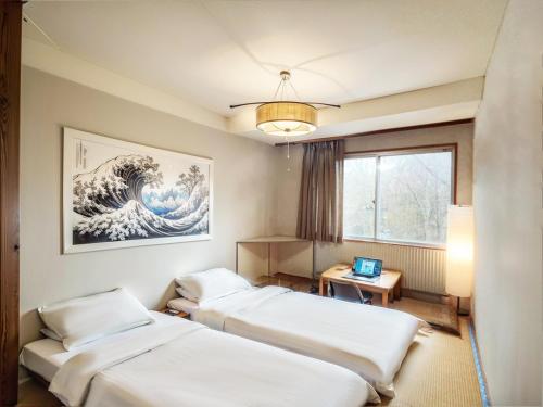 Ένα ή περισσότερα κρεβάτια σε δωμάτιο στο Wonderwall美好境界 日本藏王館