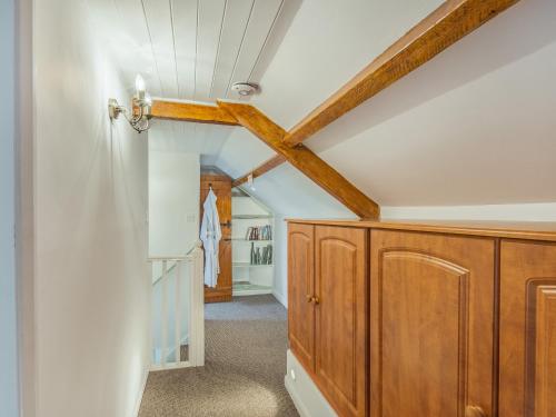 a hallway with wooden cabinets in a house at Bay - Uk44720 in Ravenscar