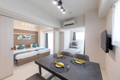 a room with a bed and a table with bananas on it at Bureau Sitennoji hotel in Osaka