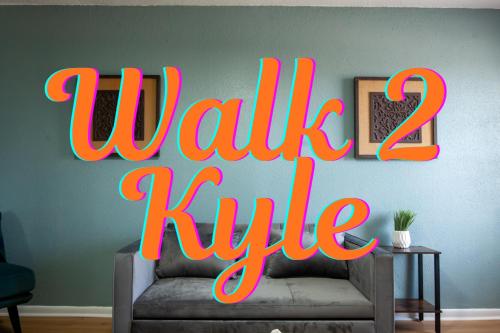 a sign that says walk two rule on a couch at Near KYLE! - Gorgeous Georgia Getaway in College Station