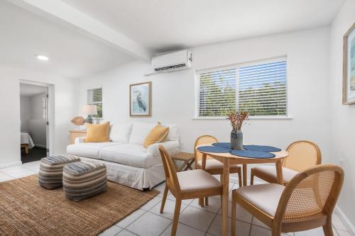 a living room with a couch and a table and chairs at Duplex-Both Units Bungalow A&B Matanzas Launch in St. Augustine