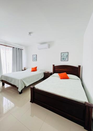 Ένα ή περισσότερα κρεβάτια σε δωμάτιο στο Family home in Bejuco with pool and beach access