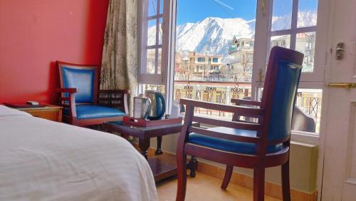 Ένα ή περισσότερα κρεβάτια σε δωμάτιο στο Pure Veg Snow Crest Inn