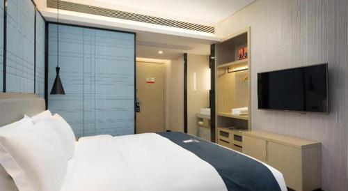 Μια τηλεόραση ή/και κέντρο ψυχαγωγίας στο Echarm Hotel Changsha Gaoqiao